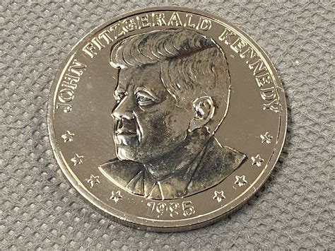 Shortly following the assassination of President John F. Kennedy in Dallas, Texas, on November 22, 1963, Congress expedited the approval of redesigning the half dollar to honor the nation's fallen president. The first Kennedy half dollar was released in early 1964, replacing the Franklin half dollar that debuted only 16 years earlier in 1948.. 