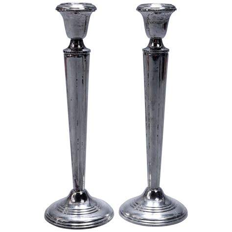 How much silver in weighted candlesticks.  With a composition of sterling silver (.  F...