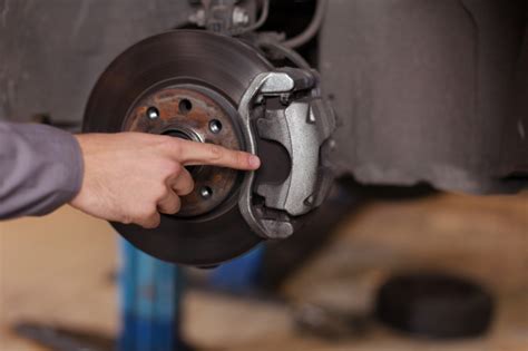 How often to change brake pads. Check brake pads by removing the wheel. If you can’t see the brake pad through the wheel, you’ll need to remove the wheel to get a better look. With your vehicle on a level surface, place your jack under the vehicle frame next to the tire you want to remove. Elevate your vehicle about 6″ off the ground, unscrew the lug nuts and remove ... 