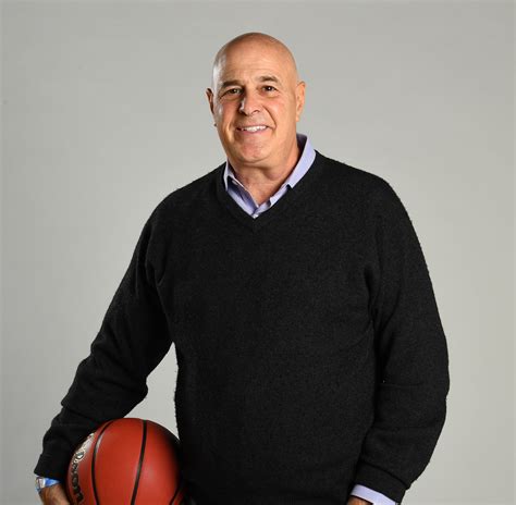 Seth Greenberg sits at his favorite table, center stage, and