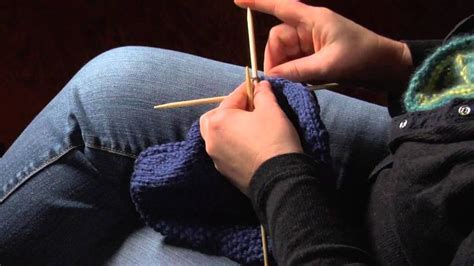How to Finish a Knitted Hat by Threading Yarn Through the Remaining