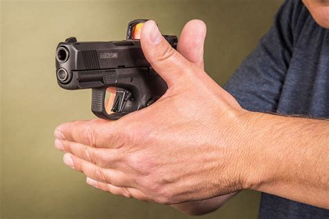 How to Hold a Handgun - Guide to Grip - Guns.com