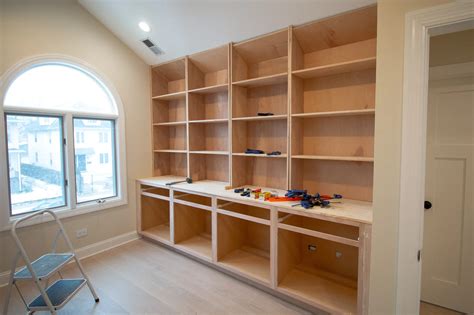 How to build a built in bookcase. To make the arches, Martino used 1/2-inch sanded plywood affixed directly onto the bookshelves with a nail gun. To further dress up the arches, she added trim then painted the entire built-in ... 