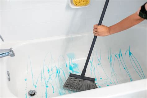How to clean a bathtub. Fill a bucket with hot water and pour the water all over the inside of your tub. Sprinkle a generous amount of baking soda around the now wet tub, or if you are dealing with an extra-dirty tub, you can use tub-and-tile cleaner instead. Refill the bucket with roughly a half-gallon of hot water and add about two tablespoons of your go-to dish ... 