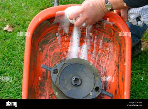 How to clean a lawn mower.  These typically include soapy water, a soft b...