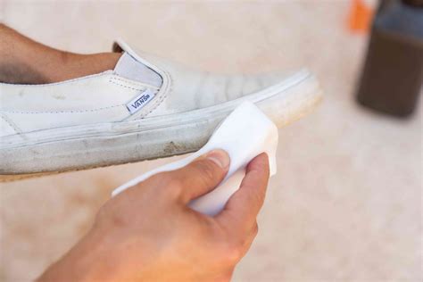 How to clean a vans shoes. Mix baking soda into the water. Dip the sponge into the cleaning solution. Scrub the shoes with a sponge 9 to 10 times. Wipe the extra water with a towel. Hence the yellowish color of your checker vans-slip-on is gone. 