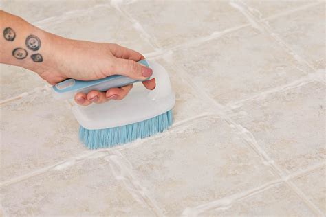 How to clean floor tile grout without scrubbing. Cleaning the grout immediately brightens up the floor and gives the whole room a fresher, cleaner look. It restores the crisp, uniform appearance that the floor had when it was first installed. The lighter color of the grout after cleaning contrasts nicely with the tiles for a put-together look. 