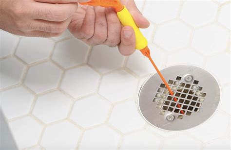 How to clean out shower drain. Before you go the chemical route to clear a slow drain, try baking soda and vinegar! Pour 1 cup of white vinegar into the drain, followed by 2 tablespoons of baking soda. You will immediately begin to see and hear a chemical reaction. Pour an additional cup of white vinegar into the drain to intensify the reaction. 