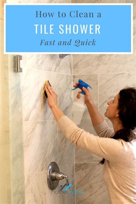 How to clean shower tile. Create a Cleaning Solution. Fill a spray bottle with very warm water and add one teaspoon of a mild dishwashing liquid. Shake well to mix. Choose a pH-neutral dishwashing liquid that does not contain dyes or any acidic ingredients like lemon or vinegar. You can also use a commercial marble cleaner to clean your shower. 