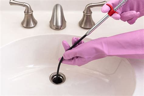 How to clean the drain in bathroom sink. Stick the funnel in the overflow hole in your sink. · Pour the baking soda down the funnel. · Next, slowly pour the vinegar down the funnel. · Let this sit for... 