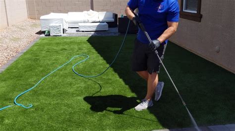 How to clean turf. 6. Apply a turf deodorizer (optional) If the odor persists after cleaning, sprinkle a natural turf deodorizer, such as baking soda, on the affected area and let it sit for 20 minutes before sweeping or vacuuming. Baking soda is amazing for removing the worst of odors–Fido’s pee included. 