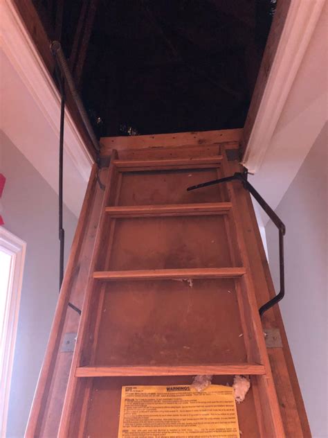 How to close an attic ladder.  This consists of three section, two of them hinged.  A broken ...