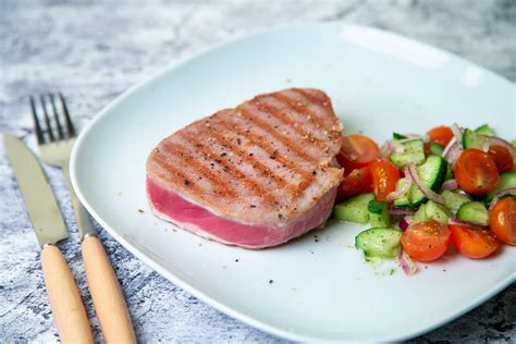 How to cook tuna steak in pan. Feb 18, 2024 · Heat a non-stick pan over medium-high heat until it’s hot. Add a drizzle of olive oil to the pan and let it heat for a minute. Carefully place the tuna steak on the pan and sear it for about 2-3 minutes on each side for a rare to medium-rare doneness. If you prefer your tuna steak more well-done, cook it for an additional 1-2 minutes on each ... 