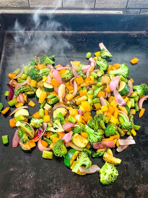 The perfect temperature and cooking time for hibachi vegetables on a Blackstone griddle will vary depending on the specific veggies you're cooking. Generally, a temperature of around 375-400°F is best for cooking a variety of vegetables.. 
