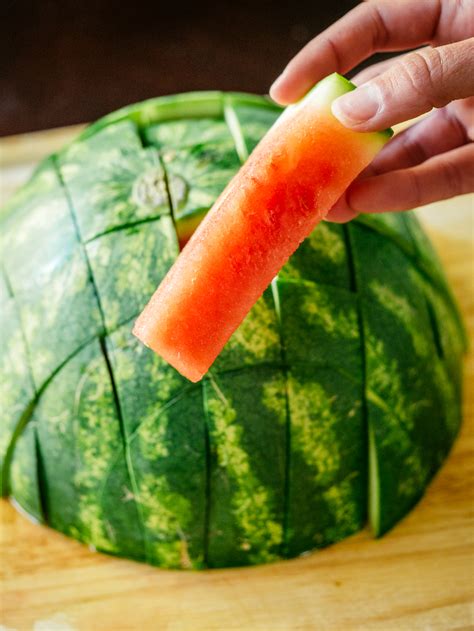 How to cut watermelon. Jun 6, 2022 · With a sharp chef’s knife, slice off both ends. Place the watermelon on one of the cut sides and use the knife to cut away strips of the rind and white flesh until none remains. Slice the flesh ... 