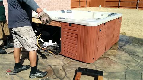 How to dispose of a hot tub. Use a box cutter or knife to cut the cover along the seams into separate, smaller pieces. Unzip and remove the vinyl covering to take out foam inserts. Remove any plastic wrap, metal, or aluminum pieces attached to the foam inserts. Cut the vinyl and leftover foam inserts into smaller pieces for easier disposal. 