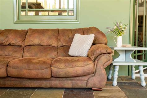 How to get rid of old sofa. Wash It Away. Add a squirt or two of a gentle dishwashing liquid to a cup of cool water, swishing the liquid around to stir in the soap. Dip a sponge or a white lint-free cloth into the soapy water, wringing out much of the moisture. Dab, blot and wipe the affected area, wiping from the outer edges of the milk toward the center of the spill to ... 