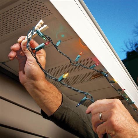 How to hang christmas lights. Ascend the ladder and start to move bulb by bulb along the gutter. Clip each bulb in as you go. Keep going until you have hung your icicle lights across the entire roofline. For shingle hooks, follow the same pattern as the mesh gutter guards but instead of clipping onto the gutter guard, hook each bulb onto the shingle. 