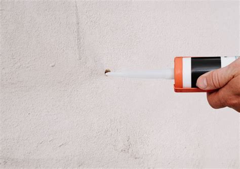 How to hang something heavy on stucco.  Put tape on stucco to reduce splintering.  J...