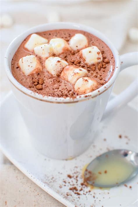 How to heat milk for hot chocolate. In Microwave. First, pour almond milk in a microwave-safe mug and microwave on high for 1 minute and remove. Second, whisk in cinnamon, cocoa powder and maple syrup until smooth. Put it back and microwave for another minute. Remove and stir it well before serving. 