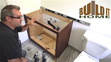How to install bathroom vanity. Get ready the area for bathroom cabinet. Use a stud finder to locate the studs in the area behind where the vanity cabinet will be installing. Mark up the ... 