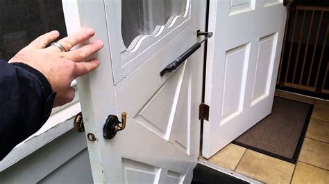 Step 1 Door closer. Make sure the door is completely closed. push up from the bottom to remove the pin from the bracket that connects the barrel to the door frame and release the door closer barrel. If the pin is under too much tension, open the door about an inch and slide the open clip (metal washer that keeps the screen door open) against .... 