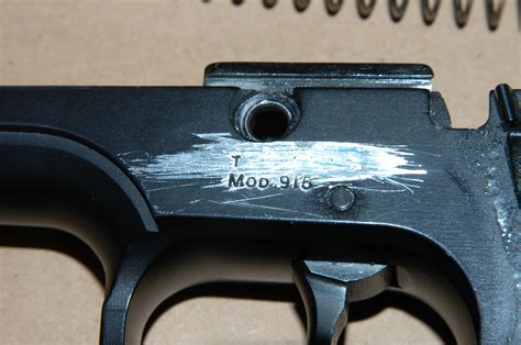 Some serial numbers are located underneath the frame in front of the trigger guard. Others are on the rear of the frame, above the gun's grip. Look up the pistol's full serial number -- including all letters and numbers -- in the back section of the "Standard Catalog of Smith & Wesson" book.. 