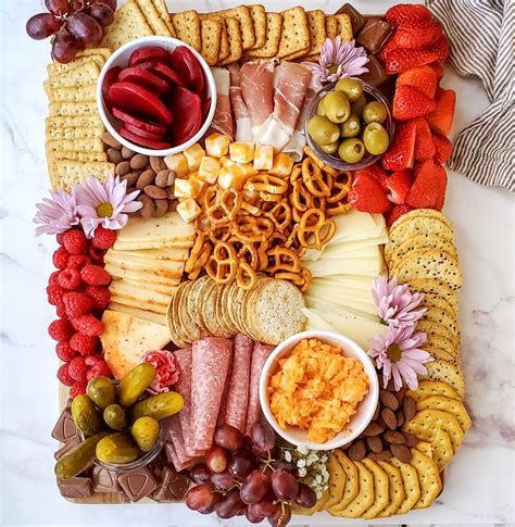 How to make a charcuterie board. Dec 31, 2021 · You will absolutely love this easy-to-assemble charcuterie board that is jam-packed with cured meats, aged cheeses, fruit, pickled vegetables, spreads, and m... 