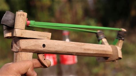How to make a powerful slingshot. A simple, powerful slingshot that uses suspension and locked motors. Can shoot just about anything depending on how you design it.-----... 