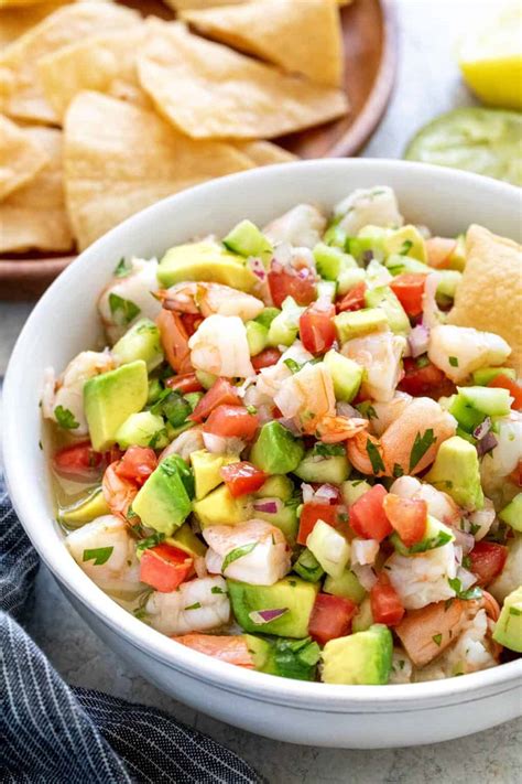 How to make ceviche. May 17, 2023 · For raw shrimp version: Soak the raw shrimp in the 1/2 cup lemon juice and 1/2 cup lime juice for 30 – 60 minutes in the fridge (or until shrimp are opaque), then add tomatoes, onions, cilantro, jalapeno, salt and pepper and marinate 30 minutes longer. Then finish with avocado and cucumber. Watch the Video! Share on Pinterest 