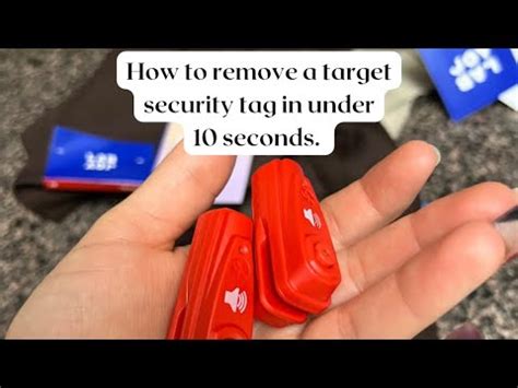 How to open target security tag. Using a Fork: One way to remove the tag is by using a fork from your kitchen drawer.Hold the tag on one side and slide one fork prong under the pin of the security tag. Twist it just like you would turn a key in a lock, applying gentle pressu 