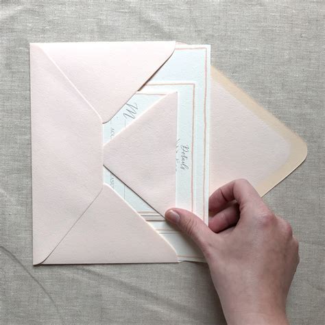 How to put invitations in an envelope