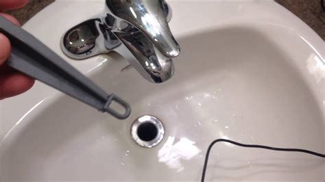 How to remove bathroom sink plug. This self-help video will teach you how to carry out simple repairs - how to change a sink plug and chain 