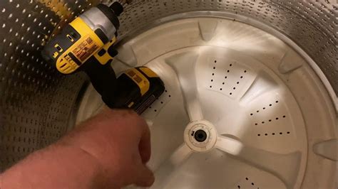 Insert a 1/4-inch nut driver into the opening in the side