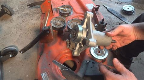 How to remove mower deck on husqvarna yth22v46. I have here an older model YTH20K46 Husqvarna mower. The bearings in the mower deck are getting old. You can feel the vibration in the deck when mowing the g... 