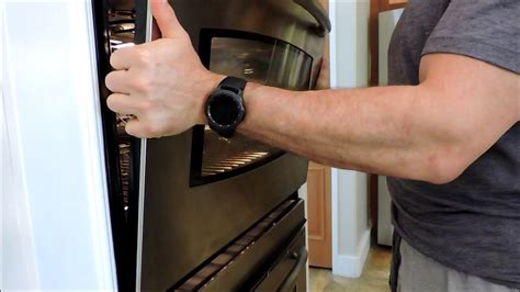 How to remove the door on a frigidaire oven. Lift the door away from the oven to remove it. Pull the door back from the oven while simultaneously lifting it. The hinges will slide free from the oven’s frame, so keep a firm grasp on the door. As long as you pull the door straight back at an angle, the hinges should clear the oven’s frame. 
