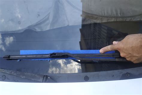 How to remove window wiper. I ended up spraying some WD-40 and who knows what else in there to loosen the arms up. Then you basically just have to grab the arms and wiggle them up and down ... 