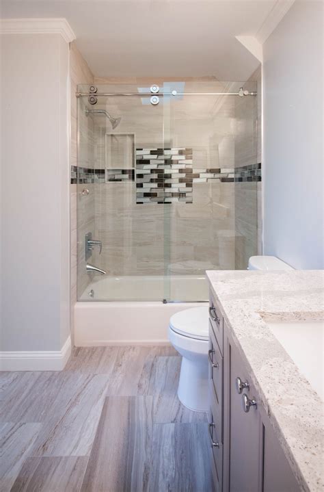 How to renovate a bathroom. A cramped floor plan and outdated finishes prompted the remodel of this small master bathroom. Relocating the toilet to the rear wall and adding a wall-mounted sink maximizes the space. The glass mosaic tile feature wall adds movement and draws attention to the high ceilings and skylight. By: ... 