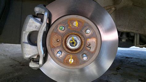 Step 2 - Replace brake pads. After you've removed the wheel, use your 12mm socket to remove the two bolts holding the brake caliper in place. There will be one on the top and one on the bottom. Pull the brake caliper out, and place it somewhere safe. Don't let it hang from the brake line.