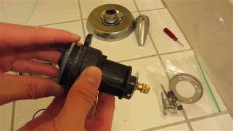 If your shower valve has an adapter, loosen the screw of the adapter by using a screwdriver and slide it off the faucet. 4. Removing the Trim Plate. The trim plate can be removed by unscrewing the screws of the trim plate and lifting it from the shower wall. Loosen and remove a couple of screws in the cartridge collar.