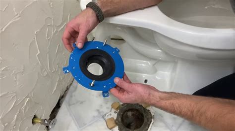How to replace a toilet flange. Apply a small amount of waterproof plumbing wax around the base of the toilet, making sure you cover the bolts and nuts completely. Replace the caps. Once the bolts are completely covered in wax, replace the plastic caps over the bolts to protect them from dirt and debris and give them a finished look. 6. 
