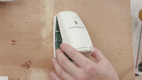 To replace your door and window sensor battery: . Loca