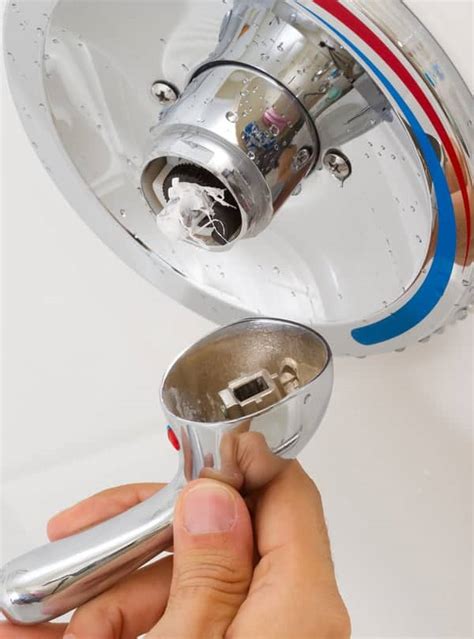 How to replace shower handle. Keep turning until the screw becomes loose enough to remove by hand or with a pair of pliers. Set the screw aside in a safe place, as you’ll need it later for reassembly. After removing the set screw, you should be able to easily slide the handle off the valve cartridge. If the handle feels stuck, wiggle it gently while pulling to loosen it. 
