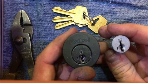 How to reset kwikset smartkey lock without key. Rotate the key 90 degrees clockwise. Insert the SmartKey tool fully and firmly into the SmartKey hole. You may feel the tool click inside the lock. Remove the SmarKey tool. Remove the current key. Insert the new key you wish to use with the lock. Make sure your key is FULLY inserted. The edge of the key touches the indent in the cylinder face. 