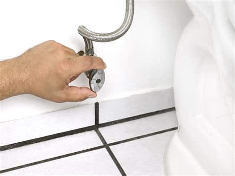 How to shut off water to toilet. The smaller shut-off valves are typically just a small metal handle you twist to close the valve and shut off water flow. You can easily find an example of one next to your toilet. The main shut-off valve, on the other hand, is usually a ball valve, identifiable by a large lever or handle, often red, that runs parallel to the pipe when open. 