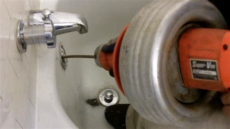 How to snake a bathtub drain. Nov 7, 2022 · Remove the Drain Stopper Plug and Rocker Arm. Use your hands or a set of pliers to squeeze the sides of the drain stopper and pull straight up and out of the drain. Be careful not to pull too hard because you want to pull the plug, stopper, and rocker arm out at the same time. The Spruce / Kevin Norris. 