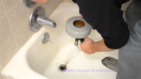 How to snake a tub drain. 2. Pour baking soda and vinegar in the drain or hose for a natural option. Pour some boiling water down the drain or hose, then sprinkle some baking soda inside the drain or hose. Pour a cup of white vinegar down the drain wait 5-10 minutes. Then, reconnect everything and run a test cycle to confirm the blockage is gone. 