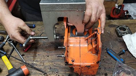 How to split a chainsaw crankcase without a puller.  I have the service manual...