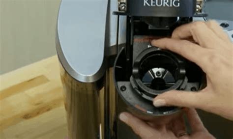 How to take a keurig apart. Step 1: Open the Machine. First, unplug your Keurig and remove and open the machine. Lift the handle to review the pod holder, and you can simply pop the pod holder out. This may require a bit of pushing from the bottom, especially if this is the first time you’ve removed it. 