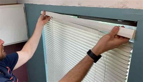 How to take levolor blinds down. Faux wood blind slats are manmade so they're water-safe. Scrub them clean with a microfiber cloth dipped in warm soapy water. Do not use abrasive cleaners which may damage the finish or paint. Dry each slat with a clean cloth. Routeless blinds slats (those with no holes through the middle) can be removed from for easier cleaning. 